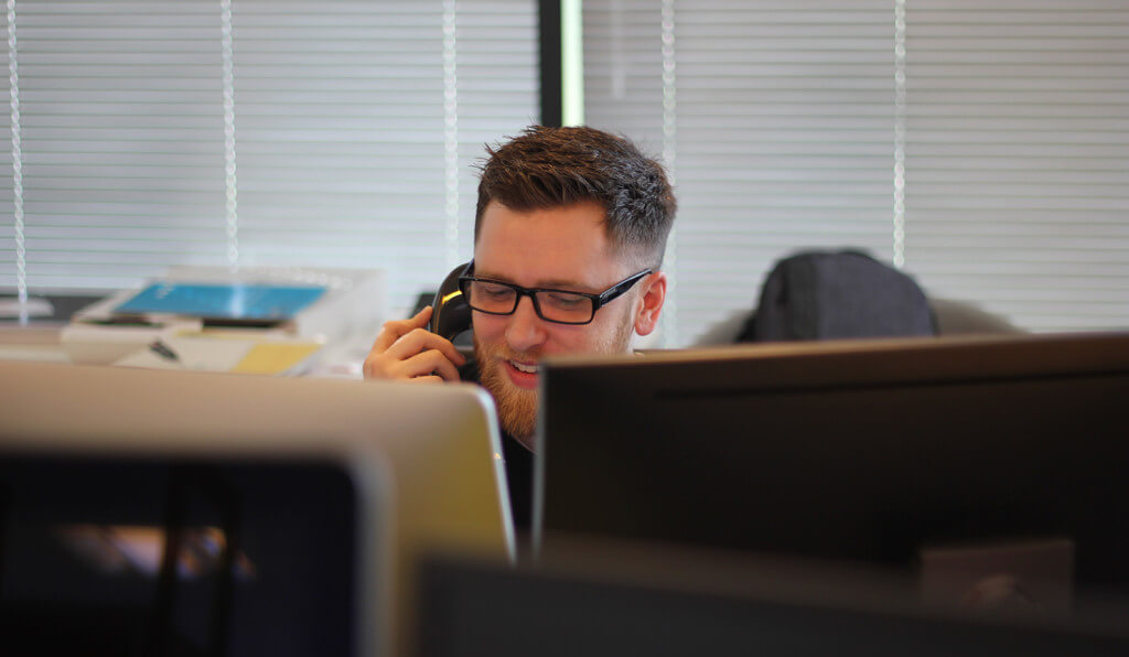 man talking on the phone in office